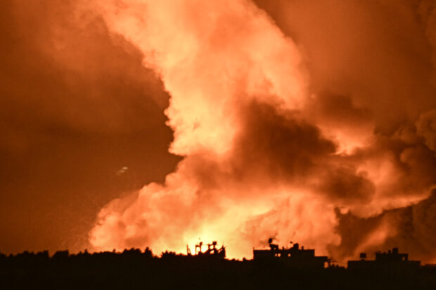 This picture taken from a position near Sderot along the Israeli border with the Gaza Strip on November 4, 2023, shows fire and smoke billowing follwoing an airstrike by Israeli forces on the Palestinian enclave amid ongoing battles between Israel and the Palestinian Hamas movement.YURI CORTEZ / AFP