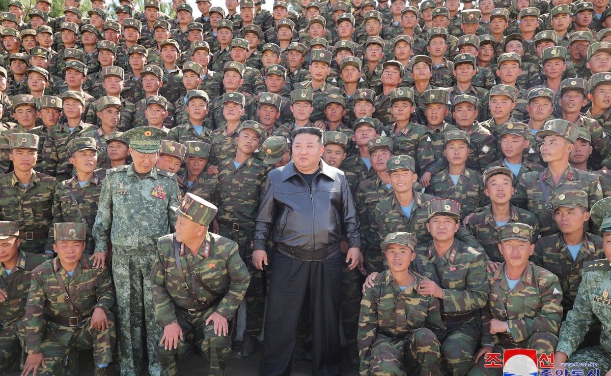 This picture taken on October 2, 2024 and released from North Korea's official Korean Central News Agency via KNS on October 4, 2024 shows North Korea's leader Kim Jong Un (center) posing with troops during an inspection at a training base of the Korean People's Army's special operations forces in the western region, at an undisclosed location in North Korea. — Agence France-Presse