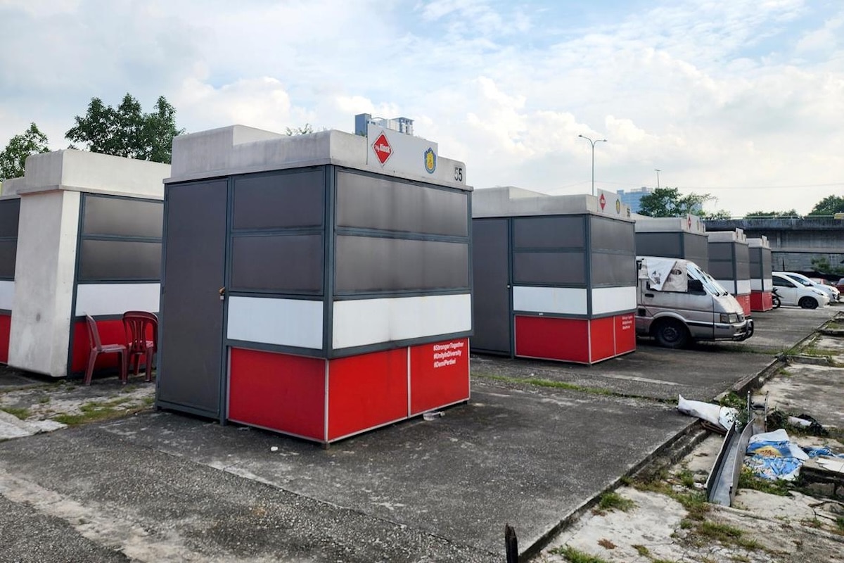 Malaysia moves to clean up its street food scene with shiny new kiosks topped with solar panels